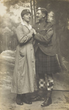 Two soldiers playing in a military concert party embrace: one is in drag and the ..., [1910-1919]. Creator: Unknown.