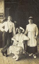 Three soldiers, two in drag, pose in costume, c1920. Creator: Unknown.