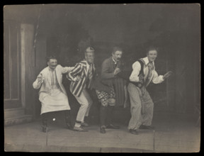 Sailors on stage in mid-pose, wearing a variety of costumes, [between 1910 and 1919?]. Creator: Unknown.