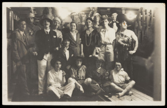 Passengers on RMS Armadale Castle, some in drag, pose for a group portrait, 1933. Creator: Unknown.