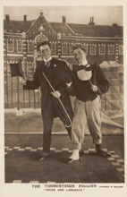 Two British soldiers dressed smartly, performing for "The Timbertown Follies", at a..., [1910-1919?] Creator: Unknown.