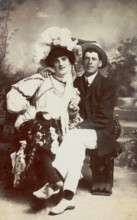 Two men, one in drag, sit together on a bench, (between 1900 and 1901?). Creator: Unknown.
