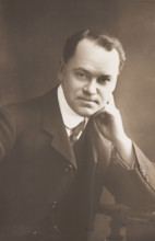 Malcolm Scott posing for a portrait, 1906. Creator: Unknown.
