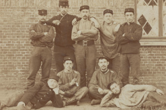 Belgian soldiers posing for a group portrait in a casual manner, 1908. Creator: Unknown.