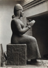 A sculpture of Gula, Mesopotamian deity of healing, with a dog at her side, c1900. Creator: Unknown.