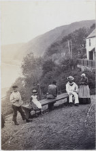 People gathered by the bench at the Lookout in Clovelly, 1860s. Creator: Unknown.