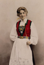 A young Norwegian woman, posing in a photographic studio wearing peasant dress, 1903. Creator: Solveig Lund.