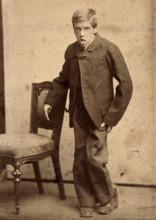 A young man, showing signs of mental deficiency, leaning awkwardly..., c1890s. Creator: Davis.
