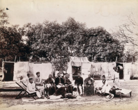 An affluent family forced to leave their home due to plague in their neighbourhood sitting...1896/7. Creator: Unknown.