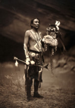 A Navajo man in ceremonial dress representing the Yebichai god Zahabolzi (Zahadolzha?), 1904. Creator: Edward Sheriff Curtis.