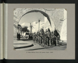 A Sudan Defence Force unit enters Tripoli, 1943. Showing Tripoli Castle on Piazza Italia. Creators: Colonial Office, Unknown.