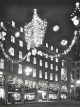 Christmas illuminations on Regent Street, West End, looking to Austin Reed at 103-113, London, 1970. Creator: Unknown.