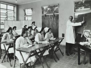 A doctor instructs trainee midwives, 1950s. Creator: Unknown.