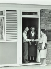16 Candy Street, Poplar, London: elderly couple greet Welfare Officer, 1962. Creator: Unknown.