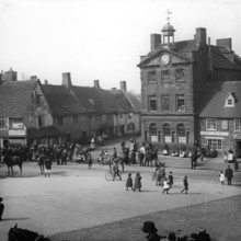Town street scene - Plume of Feathers Inn, possible Dorset England, c1900s. Creator: Robert Augustus Henry L'Estrange.