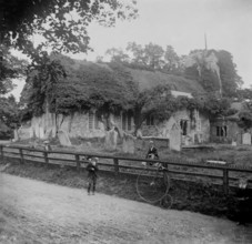 Abandoned stone church and penny-farthing bicycle, 1898. Creator: Robert Augustus Henry L'Estrange.