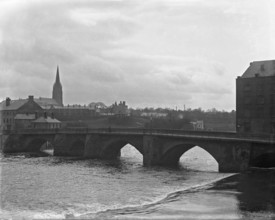 Chester weir and Old Dee Bridge on River Dee with Chester Cathedral in the background, 1902. Creator: Robert Augustus Henry L'Estrange.
