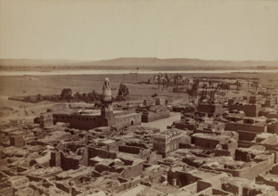 Village of Edfu, View Taken from the Pylon of the Temple, late 19th century. Creator: Henri Bechard.
