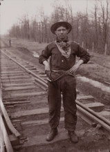 Untitled (man with pistol on railroad tracks, neg. #14), between 1910 and 1935, printed c1975. Creator: Wendell Hotter.