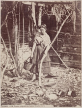 Woman Caring for Rabbits, Cordoba, c1885. Creator: Juan Laurent.