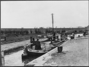 Two canal barges passing through a lock on the Grand Union Canal near Marsworth, Bucks, 1920-50.  Creator: George R Long.