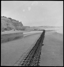 View looking north-east of Shanklin Beach, showing Admiralty scaffolding, Isle Of Wight, 1945. Creator: George R Long.