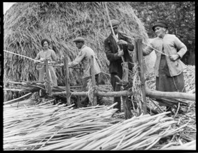 Osier strippers in Baughurst, peeling withies for making willow baskets, Hampshire, 1920-40. Creator: George R Long.