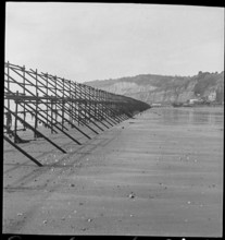 Looking south along a line of Admiralty scaffolding, Shanklin beach, Isle Of Wight, 1940-46.  Creator: George R Long.