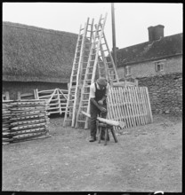 Man making a willow ladder in the village of Aston, Cote, Shifford and Chimney, Oxfordshire, 1930-50 Creator: George R Long.