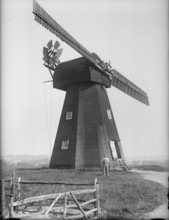 Exterior of the Old Mill, Northbourne, Kent with the miller, Mr J Court, stood outside, 1933. Creator: HES Simmons.