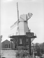 Gibbet smock mill from the opposite side of the Ashford and Hasting Railway line, East Sussex, 1934. Creator: HES Simmons.