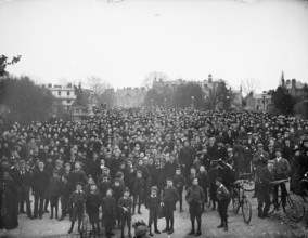 Large crowd on the bridge on May Morning to hear the college choir, Magdalen Bridge, Oxford, 1895. Creator: Henry Taunt.