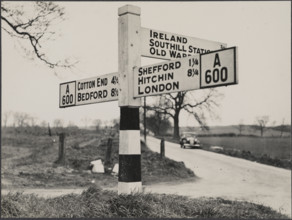 Finger post road sign on the A600 between Bedford and Shefford, Southill, 1940-1960. Creator: George R Long.