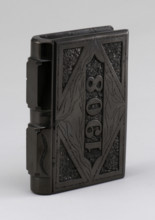 Coal carved in shape of a book, 1900s. Creator: F Jukes.