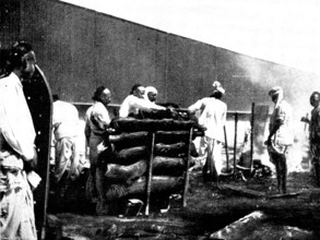 Scenes in Plague-Stricken Bombay: performing the final ceremonies at a high-caste funeral..., 1898. Creator: Gysi.