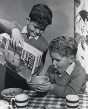 Two boys having a bowl of Quiz Corn Flakes, c1955.  Creator: Arthur Charles Kirby Ware.