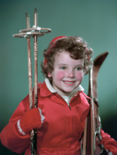Young girl with cross-country ski equipment, c1955.  Creator: Arthur Charles Kirby Ware.