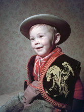 Young boy in a cowboy outfit, c1955.  Creator: Arthur Charles Kirby Ware.