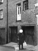 Confused milkman confronted with a doorstep on the first floor, c1955. Creator: Arthur Charles Kirby Ware.