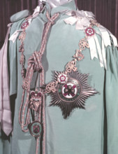 The robes, regimental badge and insignia of the Irish Guards, 1953.  Creator: Arthur Charles Kirby Ware.