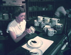 Women hand decorating souvenir mugs commemorating the Coronation of Elizabeth II, 1953. Creator: Arthur Charles Kirby Ware.