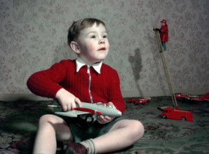 Boy playing with a toy aeroplane, c1960s. Creator: Arthur Charles Kirby Ware.