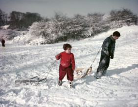 Sledging on Hampstead Heath, London, c1955.  Creator: Arthur Charles Kirby Ware.
