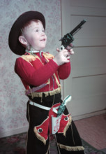 Young boy in a cowboy outfit, c1955.  Creator: Arthur Charles Kirby Ware.