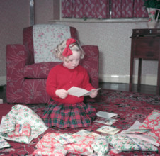 Girl opening her Christmas cards and presents, c1955.  Creator: Arthur Charles Kirby Ware.
