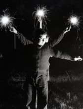Children with fireworks, c1955. Creator: Arthur Charles Kirby Ware.