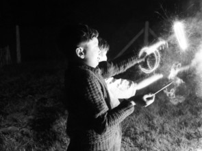 Children with fireworks, c1955. Creator: Arthur Charles Kirby Ware.