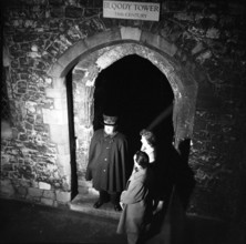 Yeoman Warder and visitors at the Bloody Tower, Tower of London, c1955. Creator: Arthur Charles Kirby Ware.