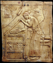 Relief pinax from Locri depicting a woman placing laundry in a laundry chest, Mid of the 5th cen. BC Creator: Classical Antiquities.