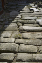 Remains of a Roman road next to the Valmardon Gate, paved with granite slabs, Toledo, Spain, 2022.  Creator: LTL.